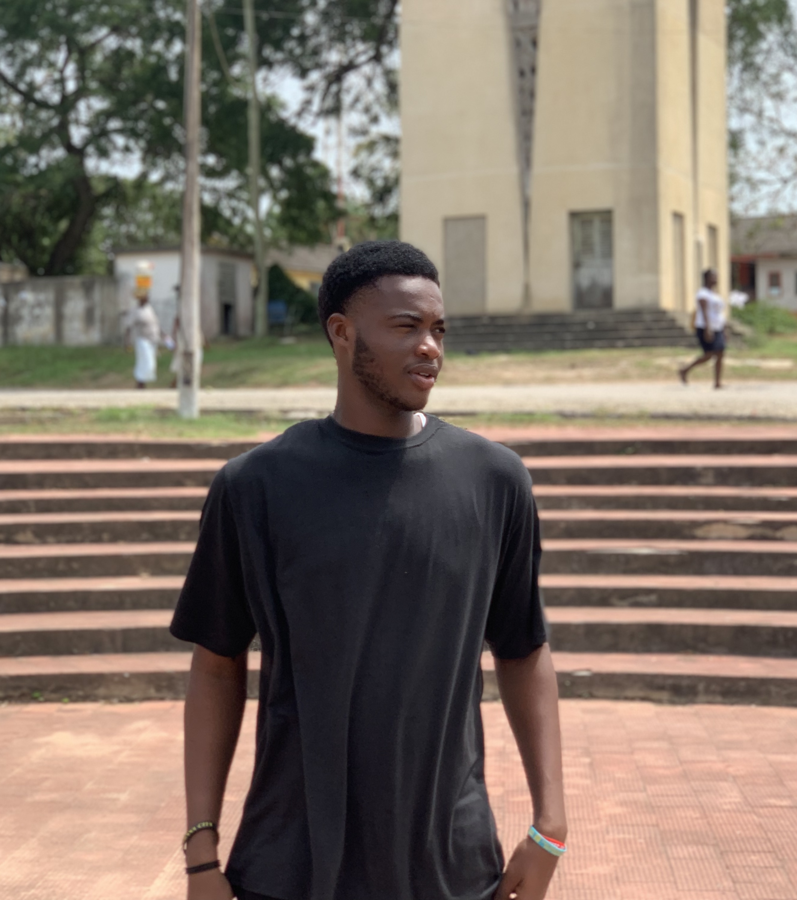 A person with their hand over their face, leaning their head back.